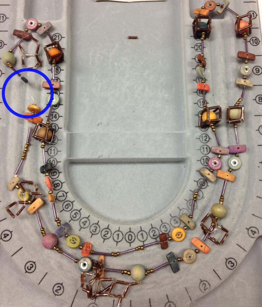 photo of the broken necklace with the break circled